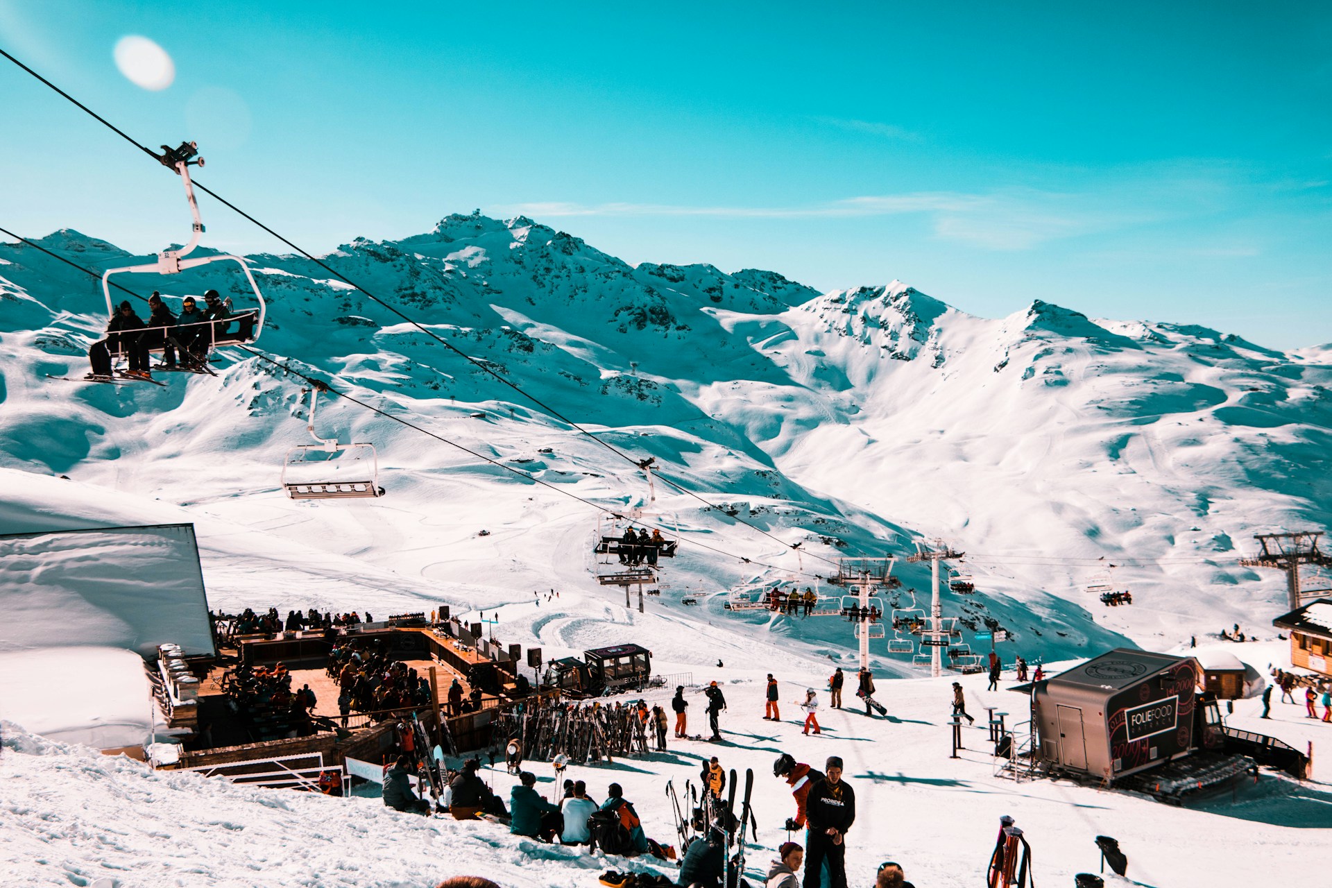 A group of skiers stopped together on a sunny slope